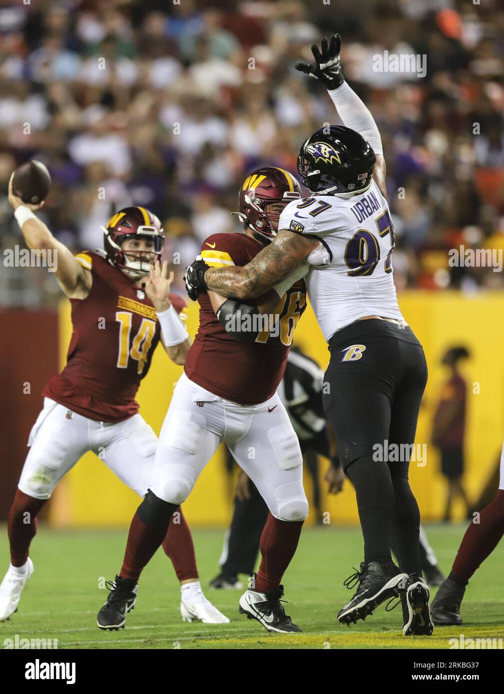 Landover, United States. 21st Aug, 2023. Baltimore Ravens DE Brent Urban  (97) making a defensive play by leaping to deflect the pass while being  held by Commanders T Sam Cosmi (76) during