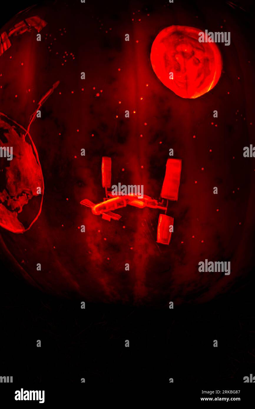 International Space Station, Moon and Earth. Space scene. Halloween theme carved pumpkin. The Stoddard Avenue Pumpkin Glow. Dayton, Ohio, USA. Stock Photo