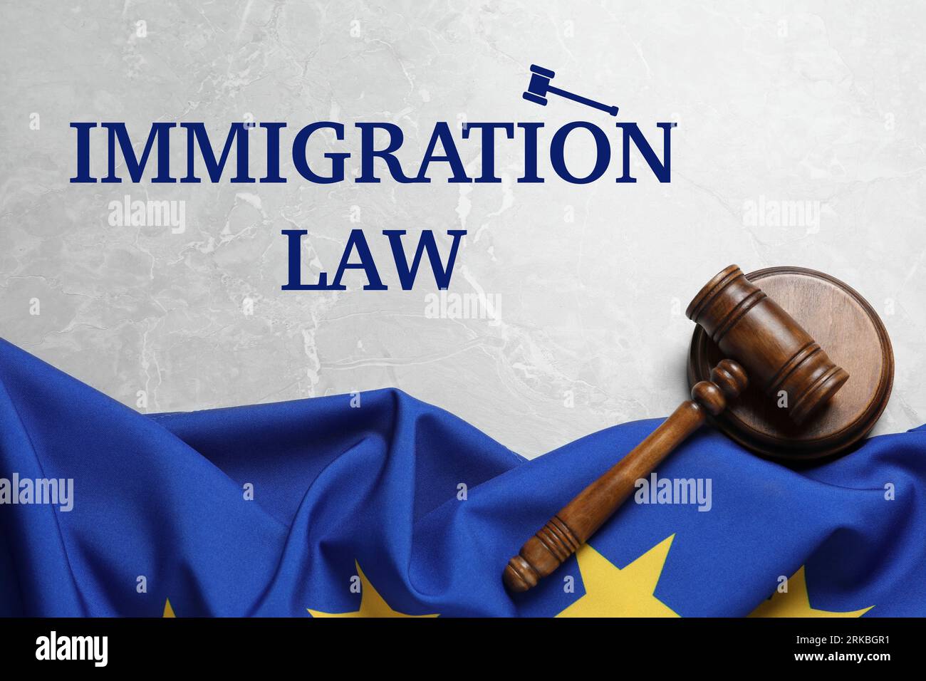 Immigration law. Judge's gavel and flag of European Union on light grey