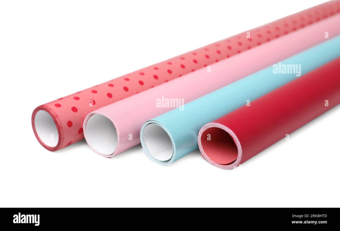 Rolls of colorful wrapping papers on white background Stock Photo - Alamy