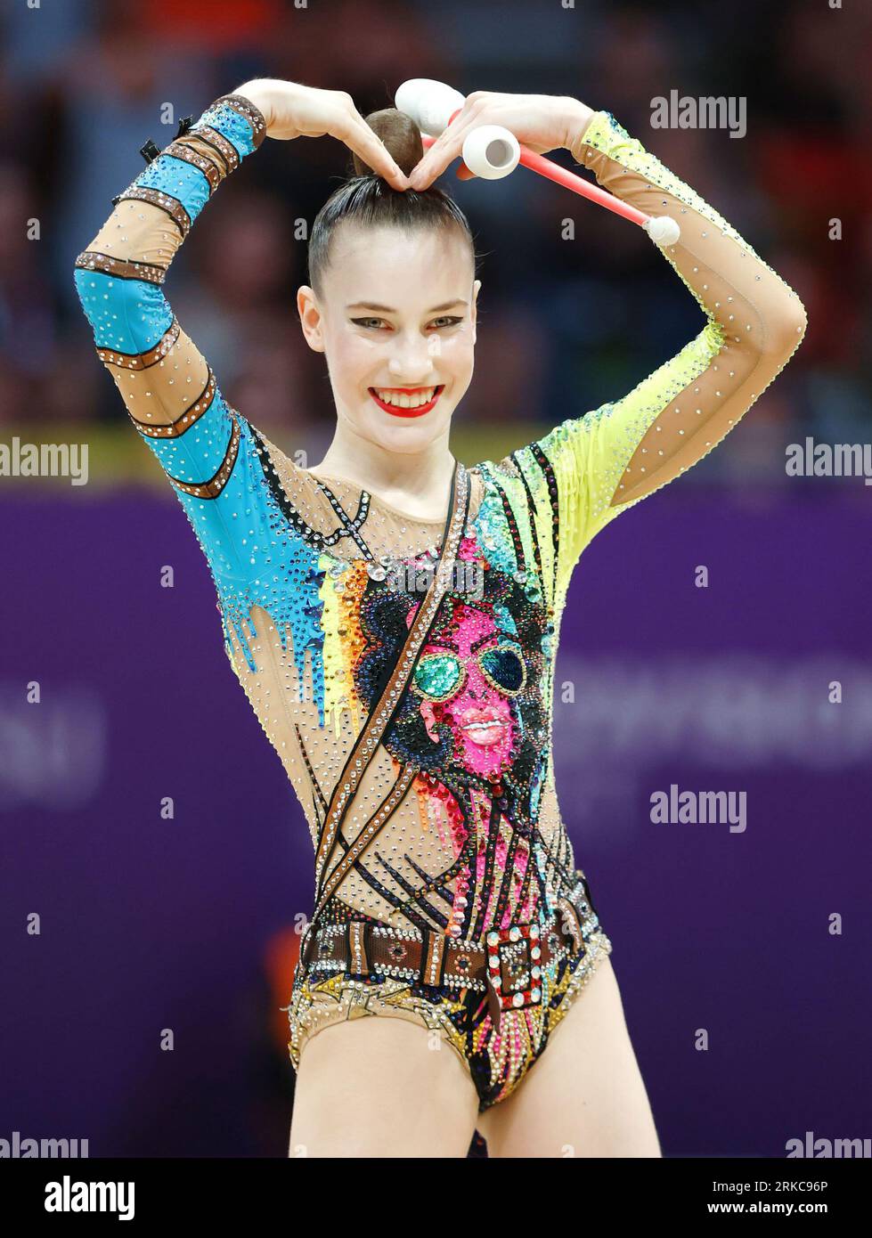 Darja Varfolomeev of Germany poses after competing in the individual apparatus clubs final