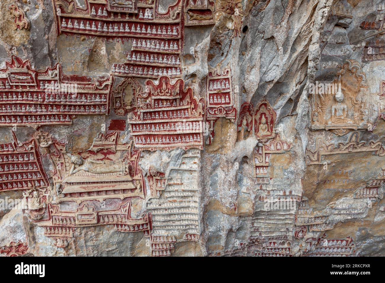Carvings in Kaw Goon cave background in Myanmar in Myanmar, back. Stock Photo