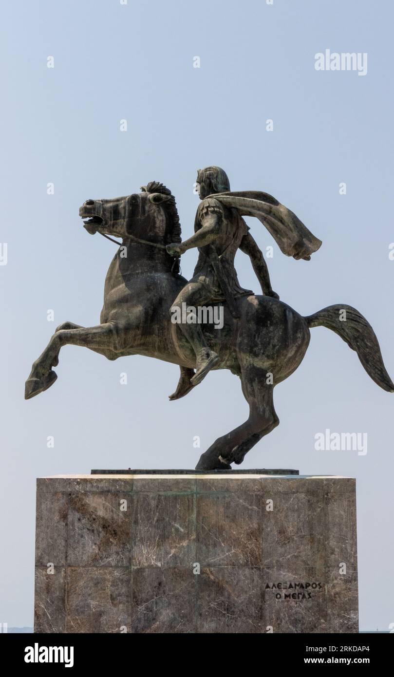 A black and white image of two stone statues of men on horseback riding ...