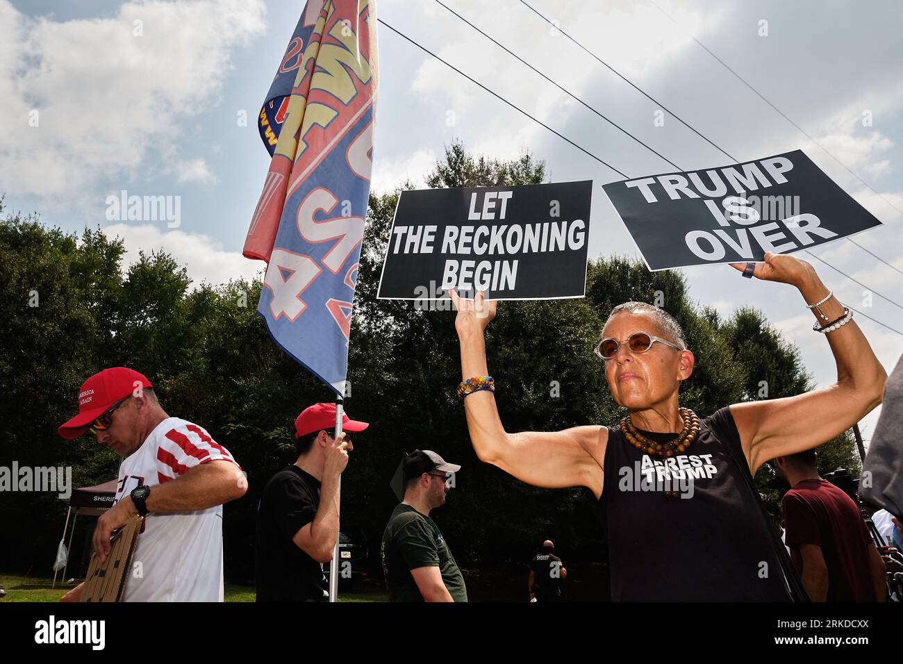 Atlanta, United States. 24th Aug, 2023. Opponents of former President Donald Trump demonstrate during the congregation of supporters and opponents of his arrival outside the Fulton County Jail, where he is expected to turn himself in to the jail this afternoon and have his mug shot taken for the first time.Photo by Carlos Escalona/CNP/ABACAPRESS.COM Credit: Abaca Press/Alamy Live News Stock Photo