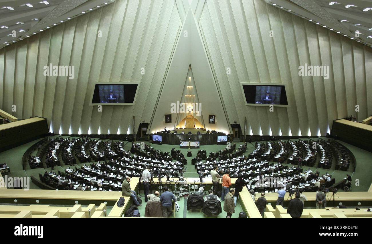 Bildnummer: 54930490  Datum: 20.02.2011  Copyright: imago/Xinhua (110220) -- TEHRAN, Feb. 20, 2011 (Xinhua) -- Iranian President Mahmoud Ahmadinejad delivers a speech in the Majlis (Parliament) in Tehran, Iran, Feb. 20, 2011. Ahmadinejad submitted a 1,769-trillion-rial (nearly 180 billion dollars) budget bill for the upcoming fiscal year to the Parliament on sunday.(Xinhua/Ahmad Halabisaz)(zl) IRAN-TEHERAN-AHMADINEJAD-BUDGET BILL PUBLICATIONxNOTxINxCHN People Politik kbdig xkg 2011 quer premiumd o0 Parlament Gebäude Totale Plenum Plenarsaal    Bildnummer 54930490 Date 20 02 2011 Copyright Imag Stock Photo