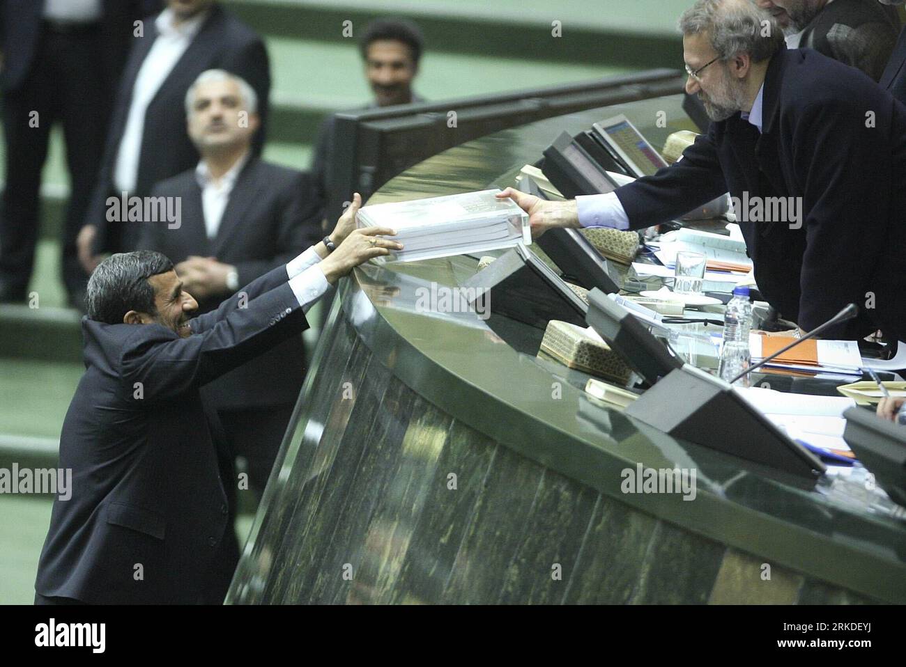 Bildnummer: 54930492  Datum: 20.02.2011  Copyright: imago/Xinhua (110220) -- TEHRAN, Feb. 20, 2011 (Xinhua) -- Iranian President Mahmoud Ahmadinejad (L) submits budget bill to Iranian Parliament Speaker Ali Larijani in the Majlis (Parliament) in Tehran, Iran, Feb. 20, 2011. Ahmadinejad submitted a 1,769-trillion-rial (nearly 180 billion dollars) budget bill for the upcoming fiscal year to the Parliament on sunday.(Xinhua/Ahmad Halabisaz)(zl) IRAN-TEHERAN-AHMADINEJAD-BUDGET BILL PUBLICATIONxNOTxINxCHN People Politik kbdig xkg 2011 quer premiumd     Bildnummer 54930492 Date 20 02 2011 Copyright Stock Photo