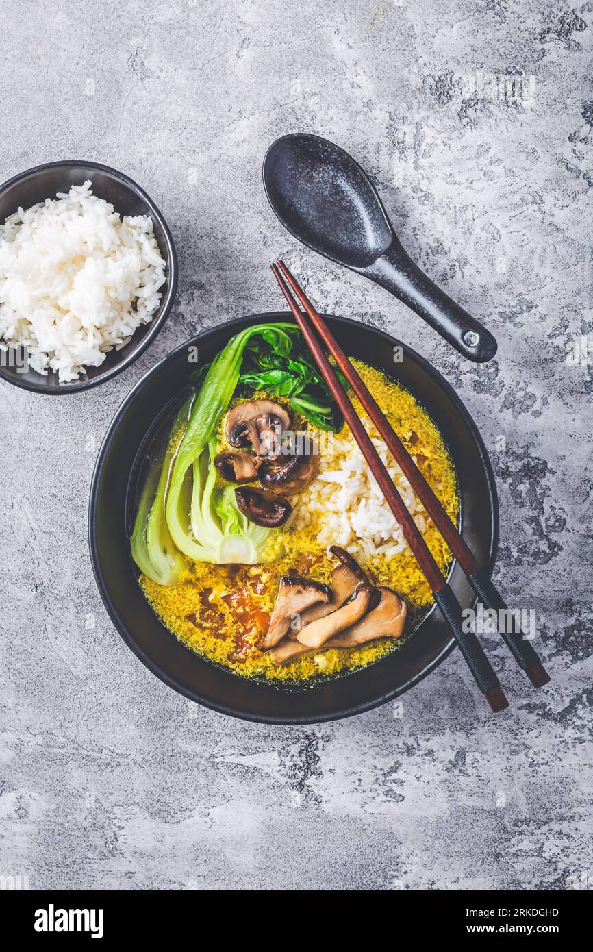 Egg flower soup, tomato egg drop soup with mushrooms, bok choy and rice