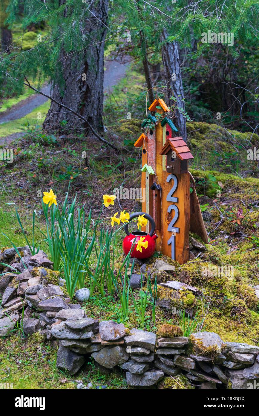 A decorative address sign in the forest on Thetis Island, Vancouver Island, British Columbia, Canada. Stock Photo