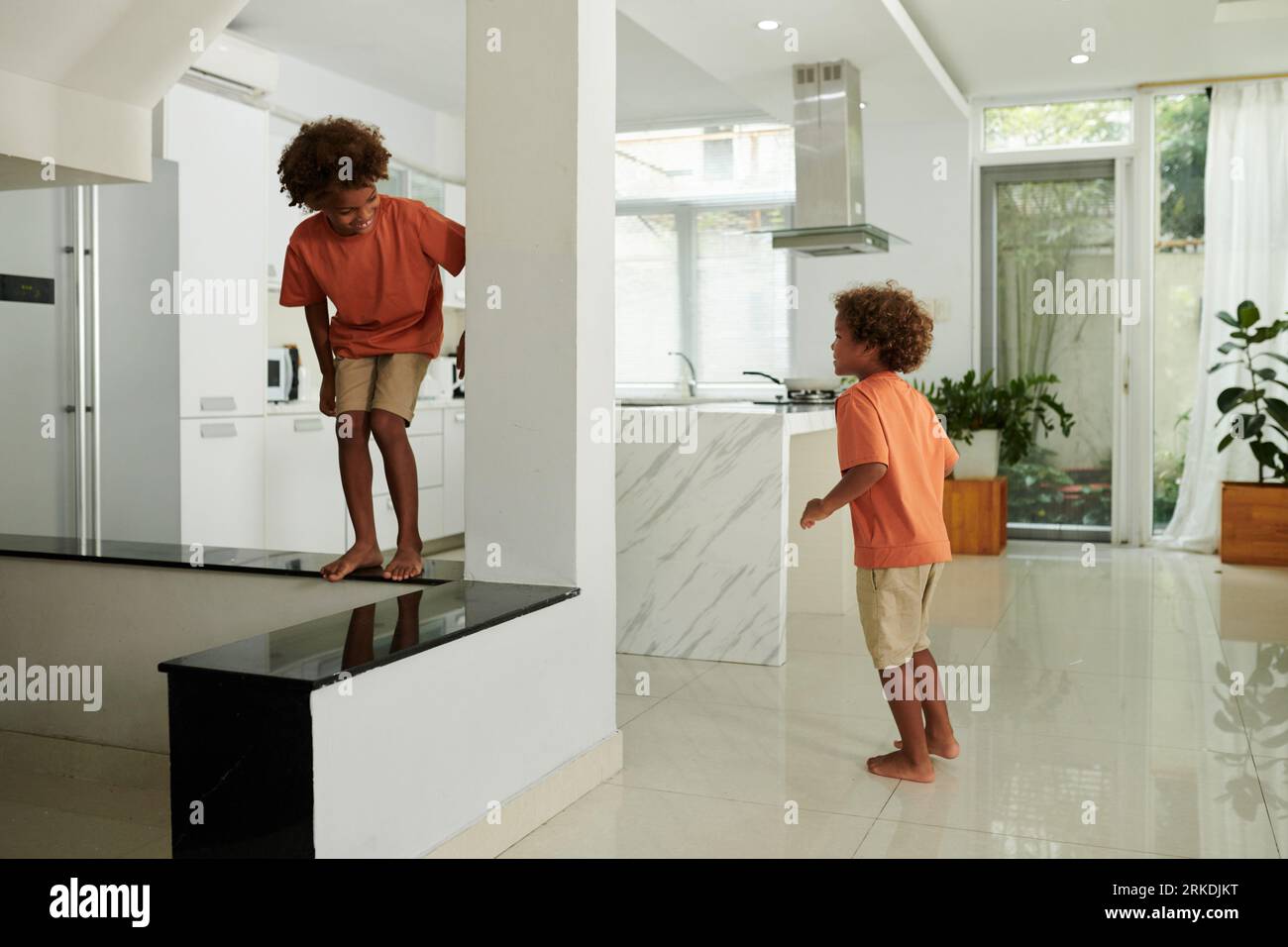 Kids running around house hi-res stock photography and images - Alamy