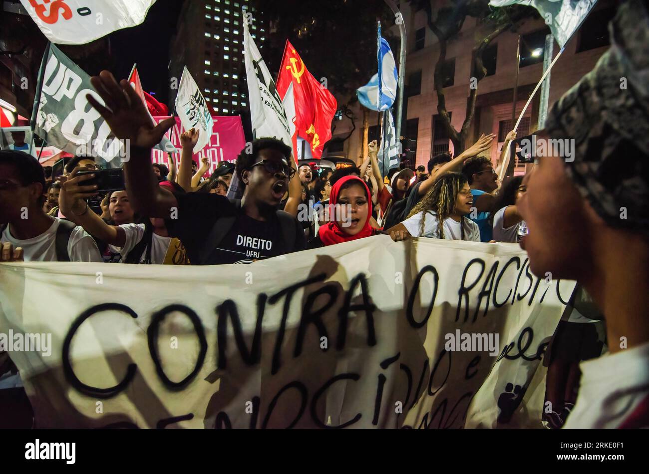 Rio De Janeiro, Brazil. 24th Aug, 2023. Protesters hold a banner and flags during the demonstration. Activists, black social movements and politicians held a demonstration against the police violence in slums of the Rio de Janeiro. The demonstration was national movement that was rallied in all country. Credit: SOPA Images Limited/Alamy Live News Stock Photo