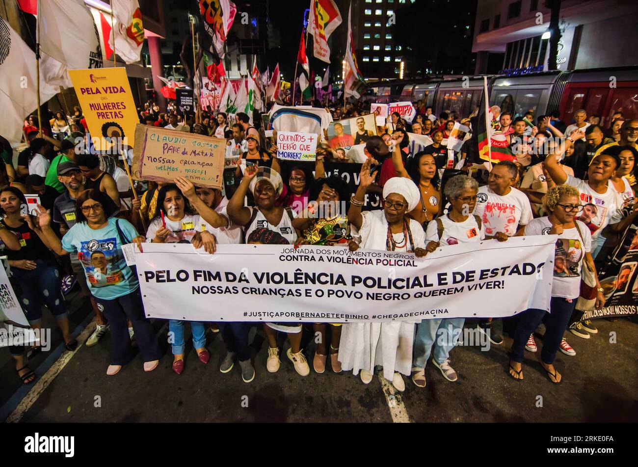 Rio De Janeiro, Brazil. 24th Aug, 2023. Protesters hold a banner and flags during the demonstration. Activists, black social movements and politicians held a demonstration against the police violence in slums of the Rio de Janeiro. The demonstration was national movement that was rallied in all country. Credit: SOPA Images Limited/Alamy Live News Stock Photo