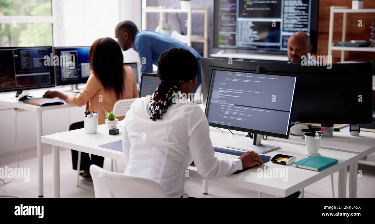 African Business Team Working On Computer. Software App Development Stock Photo
