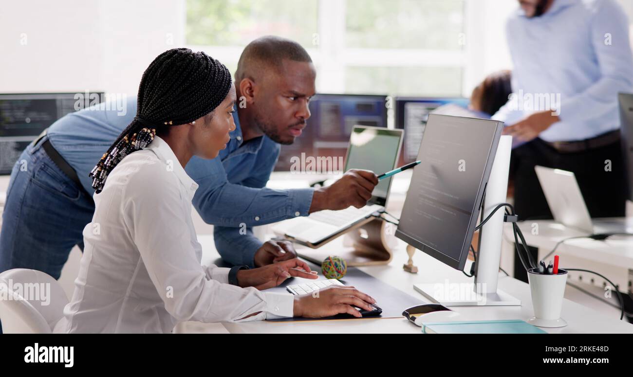 African Business Team Working On Computer. Software App Development Stock Photo