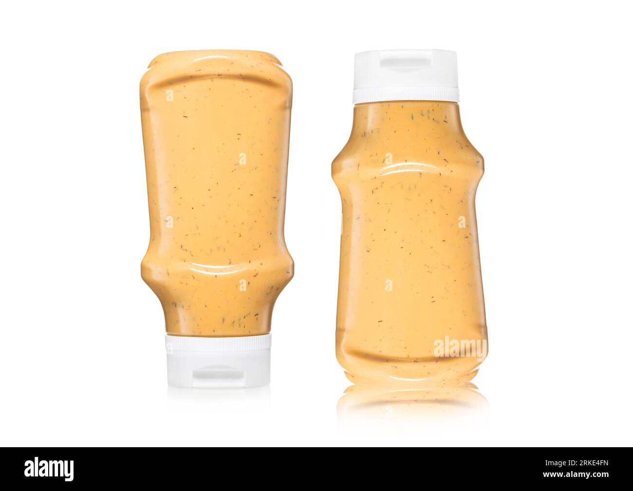 Bottles of creamy american style sauce for burger and fries on white