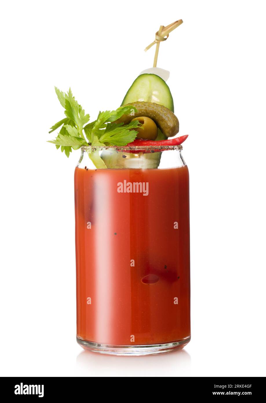 Cocktail with vodka and juice bloody mary with pickle and olive on