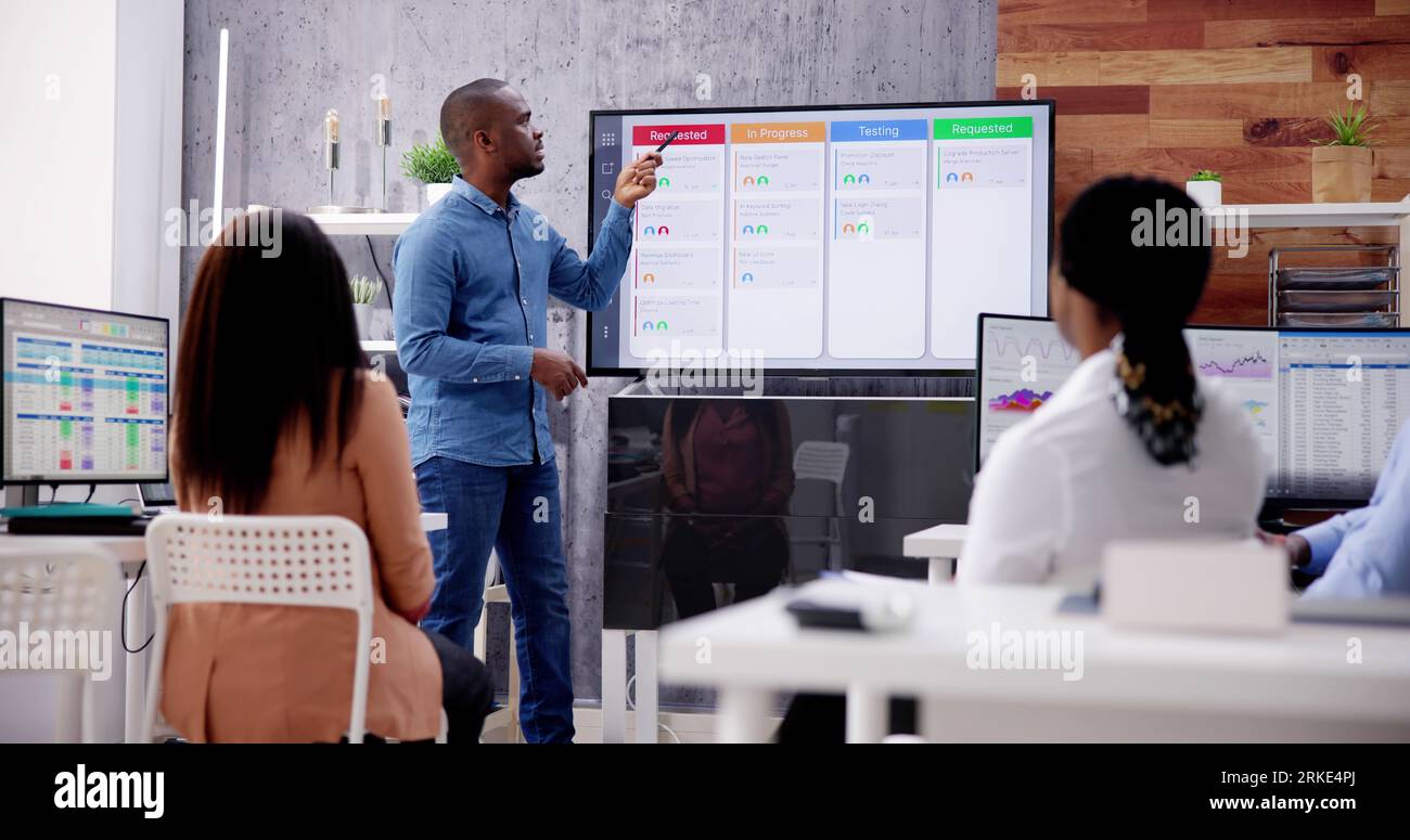 Corporate Training Presentation In Classroom With Computers Stock Photo ...
