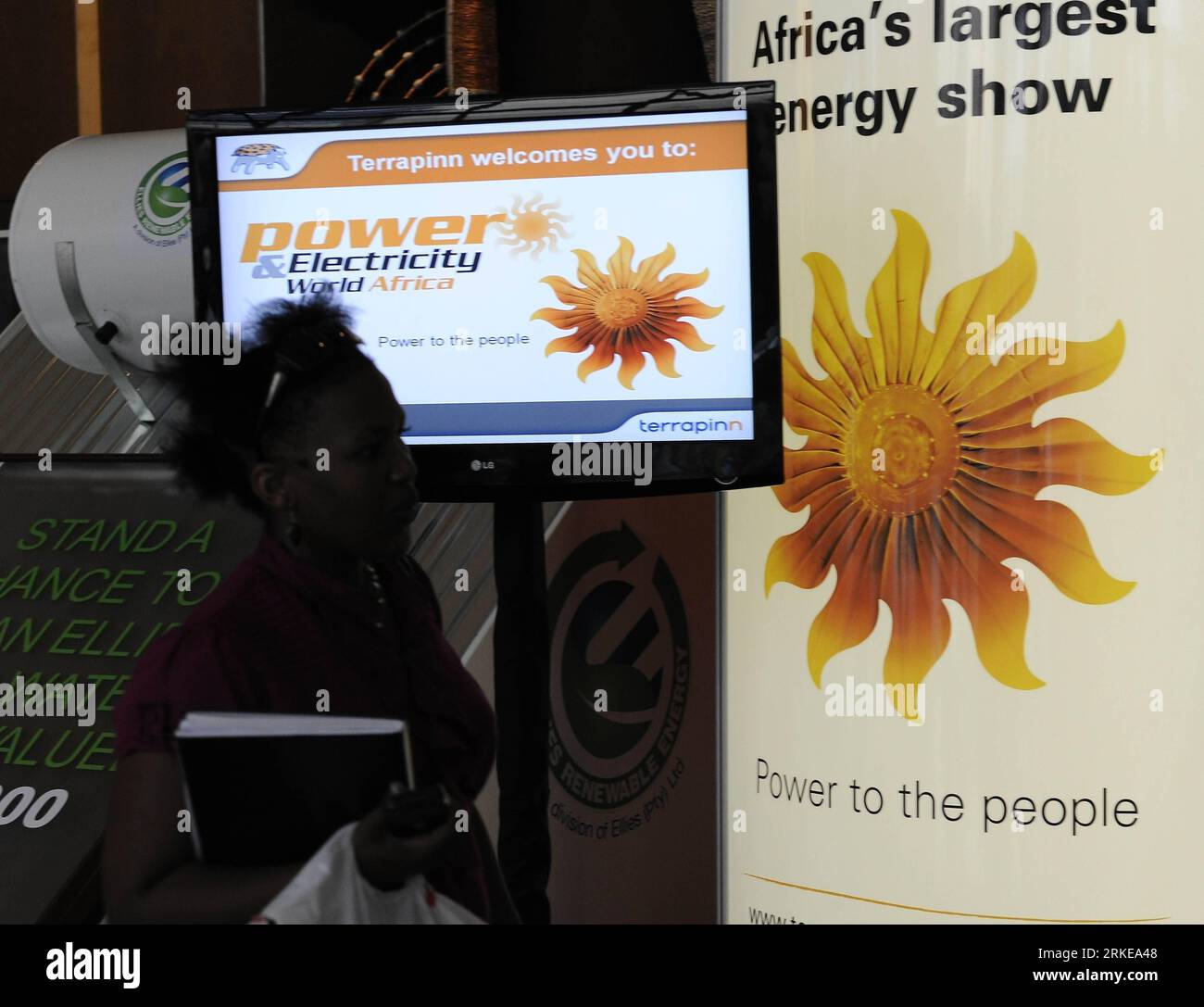 Bildnummer: 55155974  Datum: 30.03.2011  Copyright: imago/Xinhua (110330) -- PRETORIA, March 30, 2011 (Xinhua) -- A visitor passes by a poster during the Power and Electricity World Africa 2011 in Johannesburg, South Africa, March 30, 2011. The two-day Power and Electricity World Africa 2011 attracted more than 250 worldwide power companies to show their products here. (Xinhua/Li Qihua) SOUTH AFRICA-PRETORIA-POWER ELECTRICITY-EXHIBITION PUBLICATIONxNOTxINxCHN Wirtschaft Messe Strom Ausstellung kbdig xcb xo0x 2011 quer     Bildnummer 55155974 Date 30 03 2011 Copyright Imago XINHUA  Pretoria Mar Stock Photo