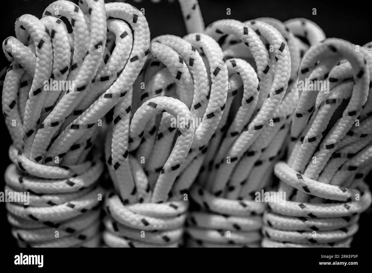 Climbing rope on dark background. Nylon rope Stock Photo