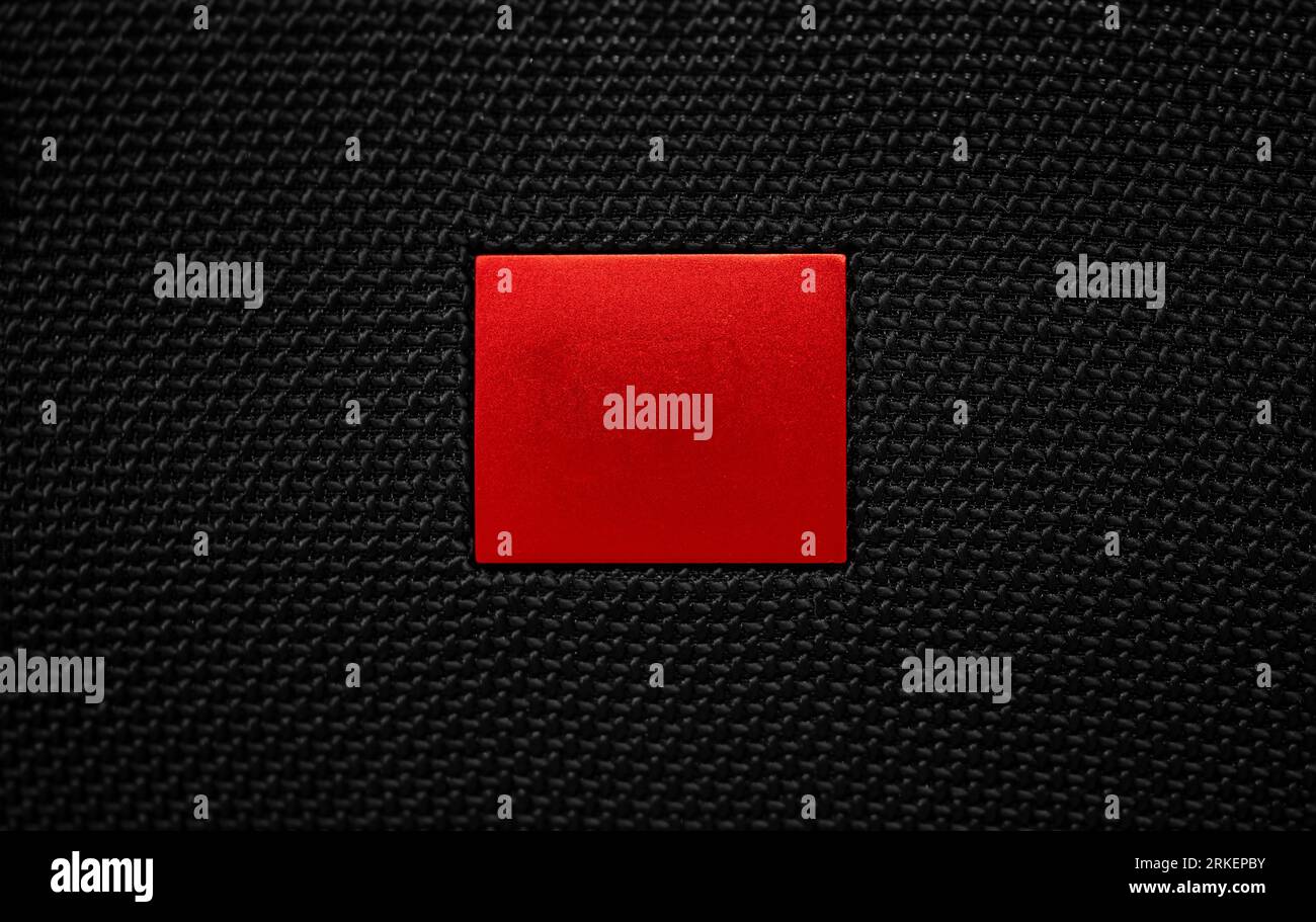 Red Stop button. Futuristic play button on a black textile window background Stock Photo