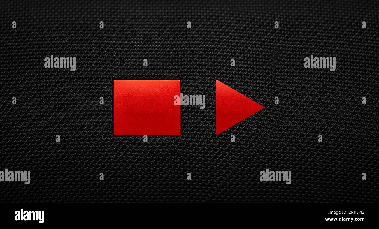 Stop and Play button on a black textile background. Video player Stock Photo