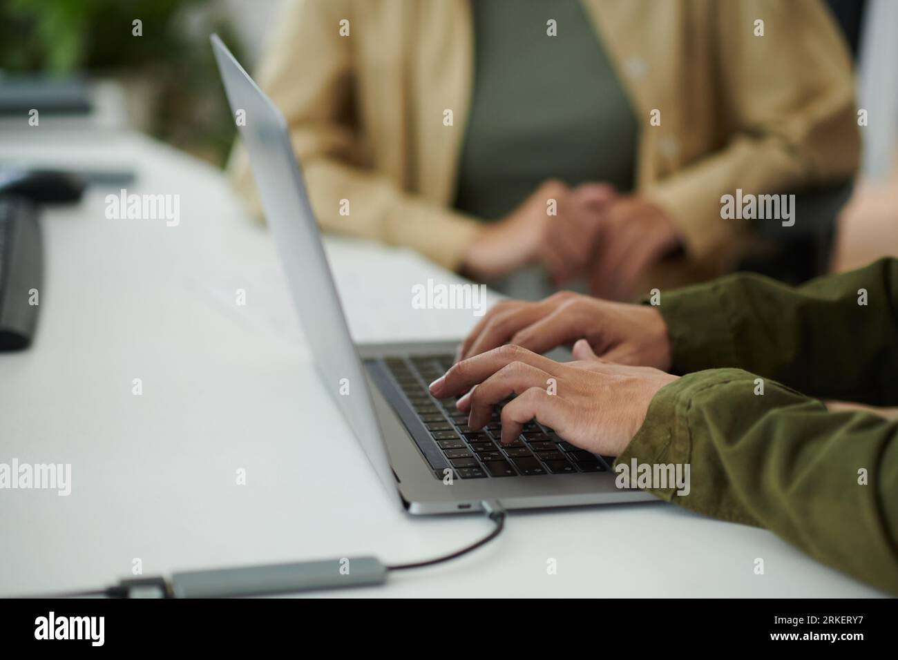 Closeup image of developer working on laptop at office desk Stock Photo