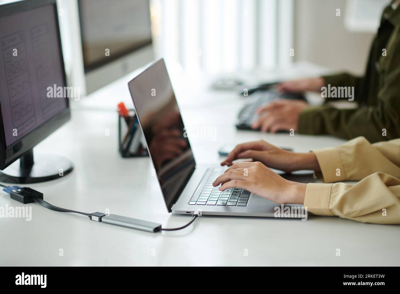Hands of software developers working in office on startup project Stock Photo