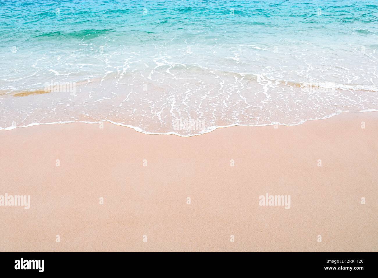 Soft beautiful ocean wave on sandy beach. Background. Copy space. Stock Photo