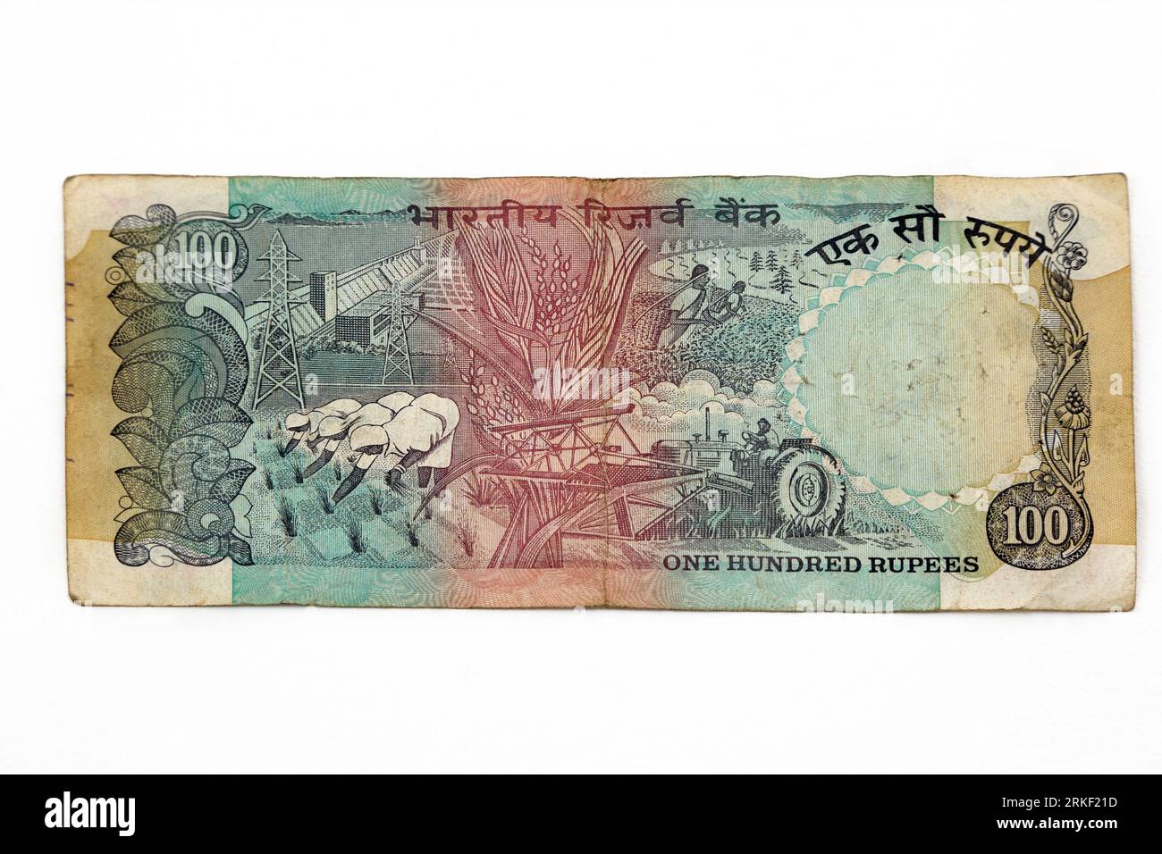 Reserve Bank of India Lion Capital Series Banknotes II - One Hundred Rupees Issued 1975 -1995 Reverse Side showing Agriculture Endevour Stock Photo