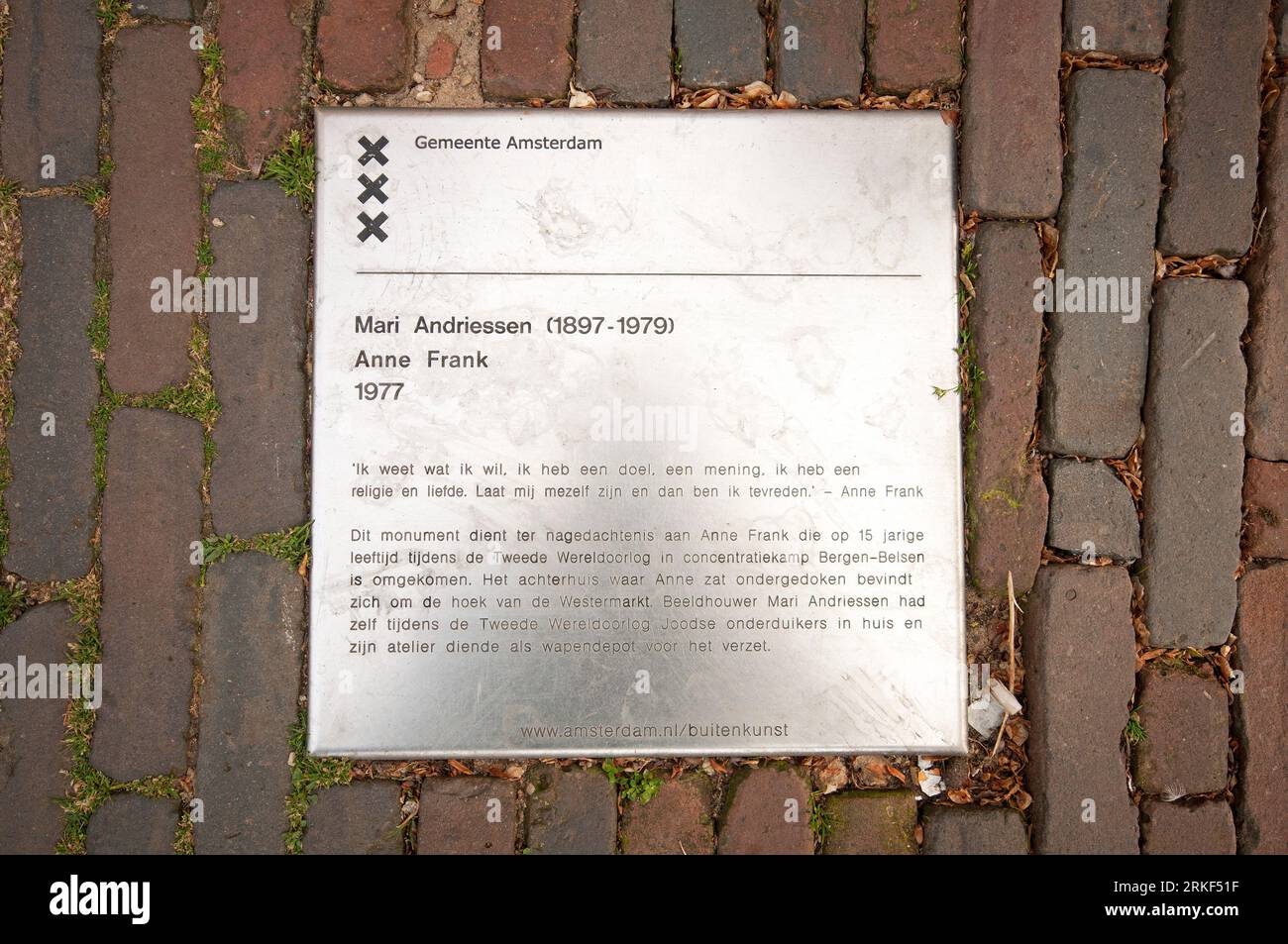 Metal plaque on the ground next the Anne Frank statue (made in 1977 by the dutch sculptor Mari Andriessen, 1897-1979), Amsterdam, Netherlands Stock Photo