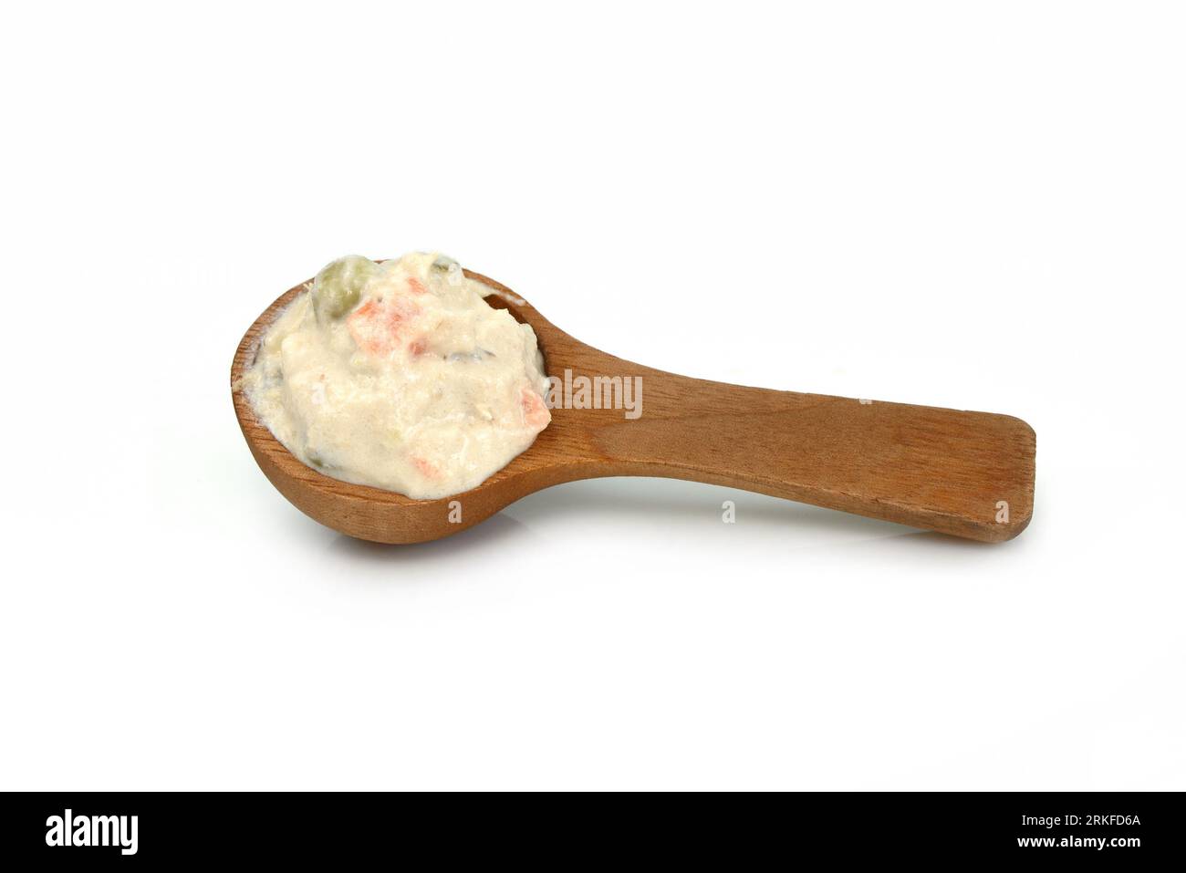 Tuna mayonnaise with tuna flake garnish isolated on white. Tuna spread