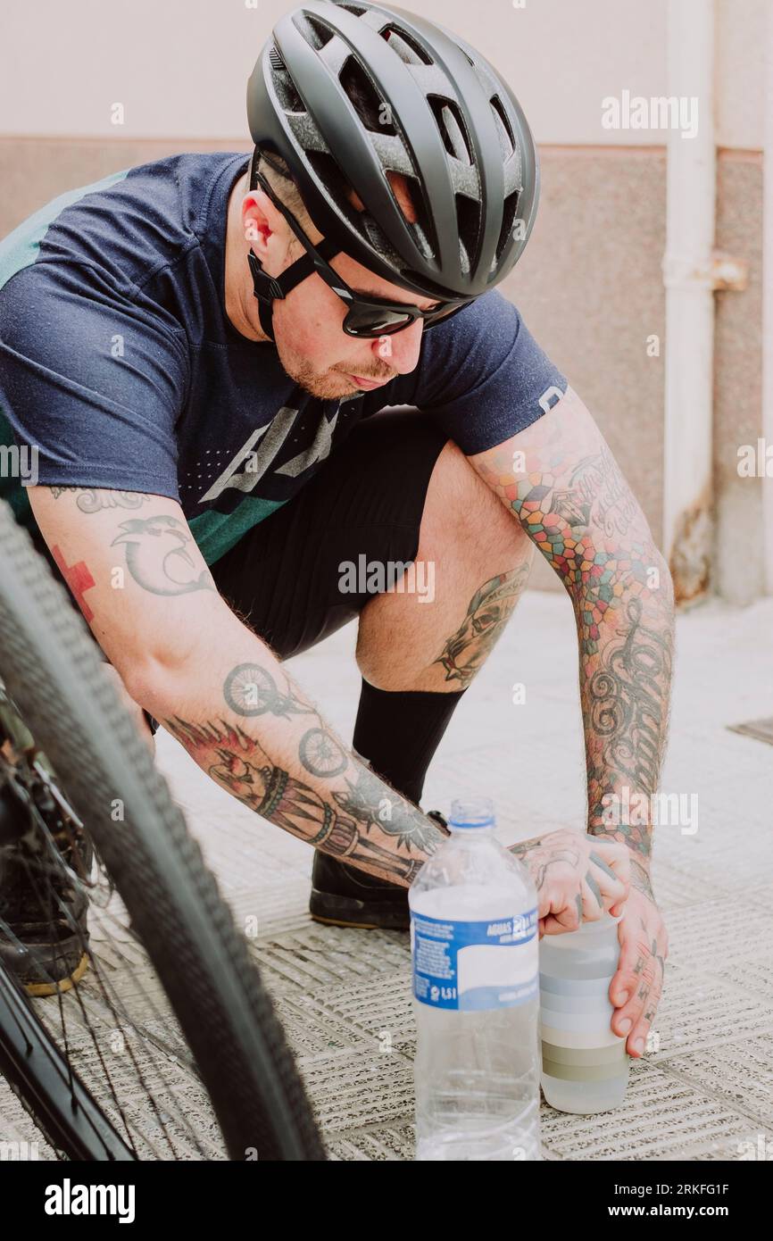 A  cyclist with water bottle during an adventure route in Tenerife Stock Photo