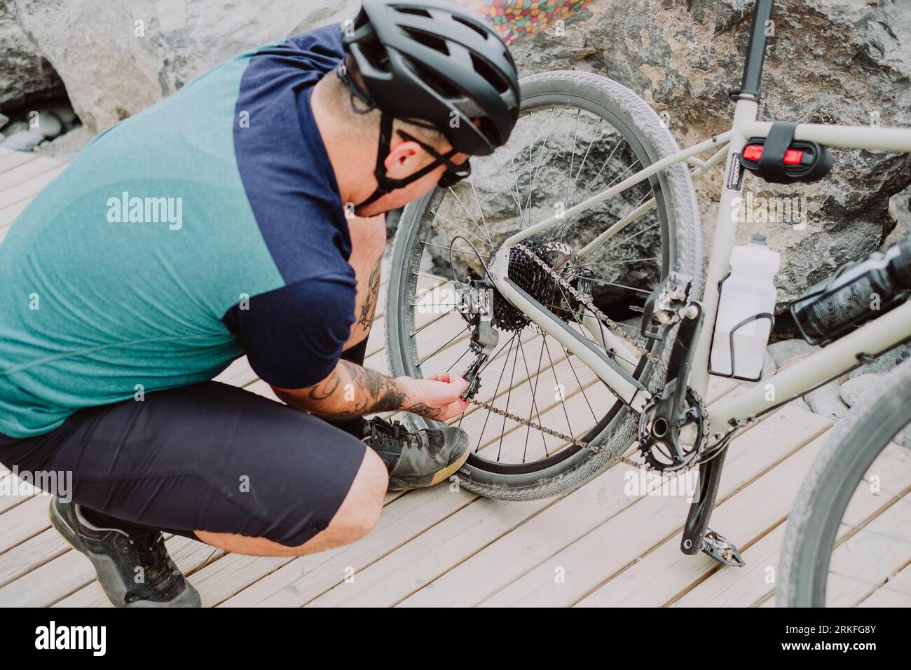 A cyclist man fix his bike during adventure route in Tenerife Stock ...