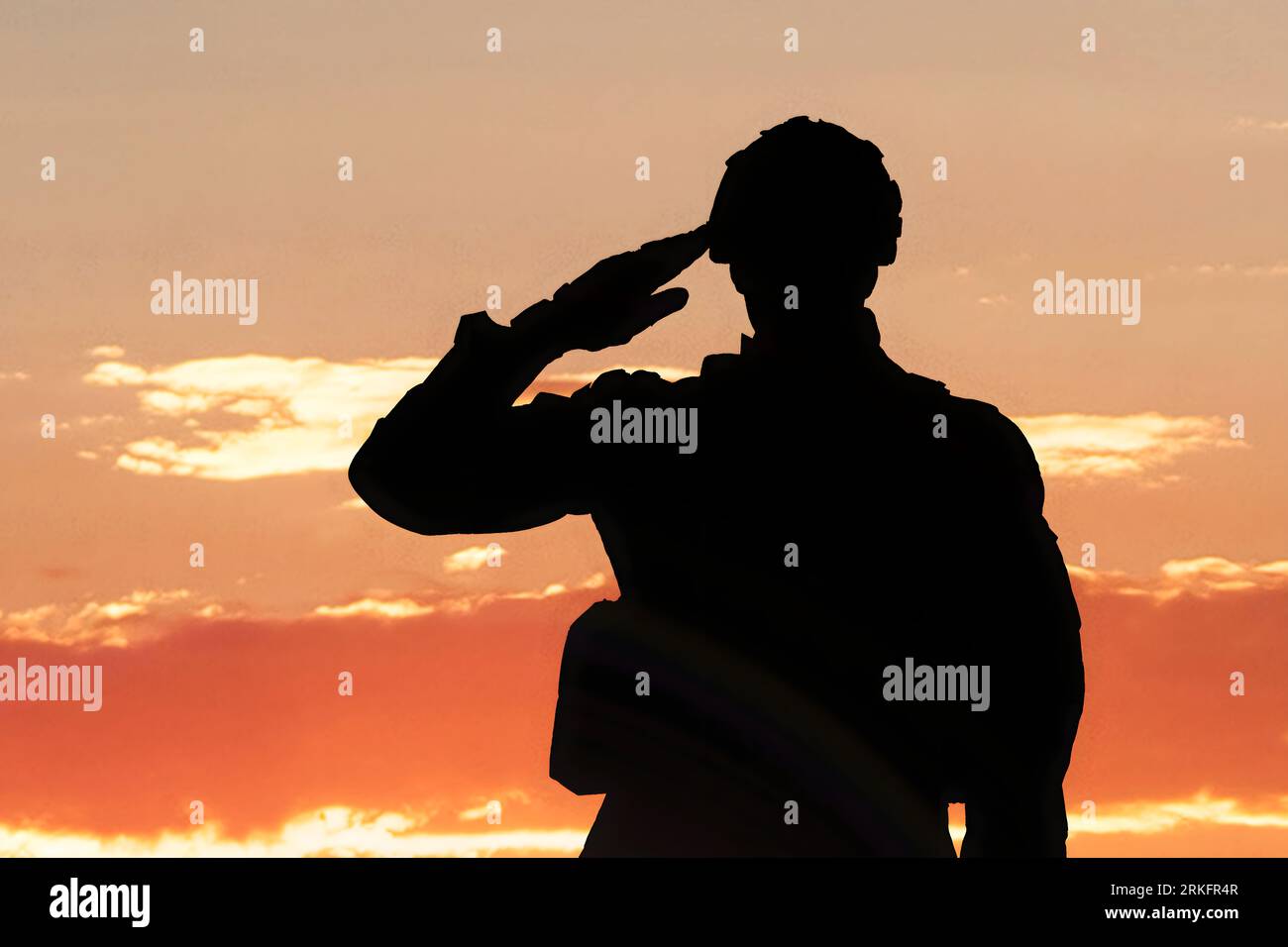 Silhouette Of A Soldier Saluting During Sunset Stock Photo - Alamy