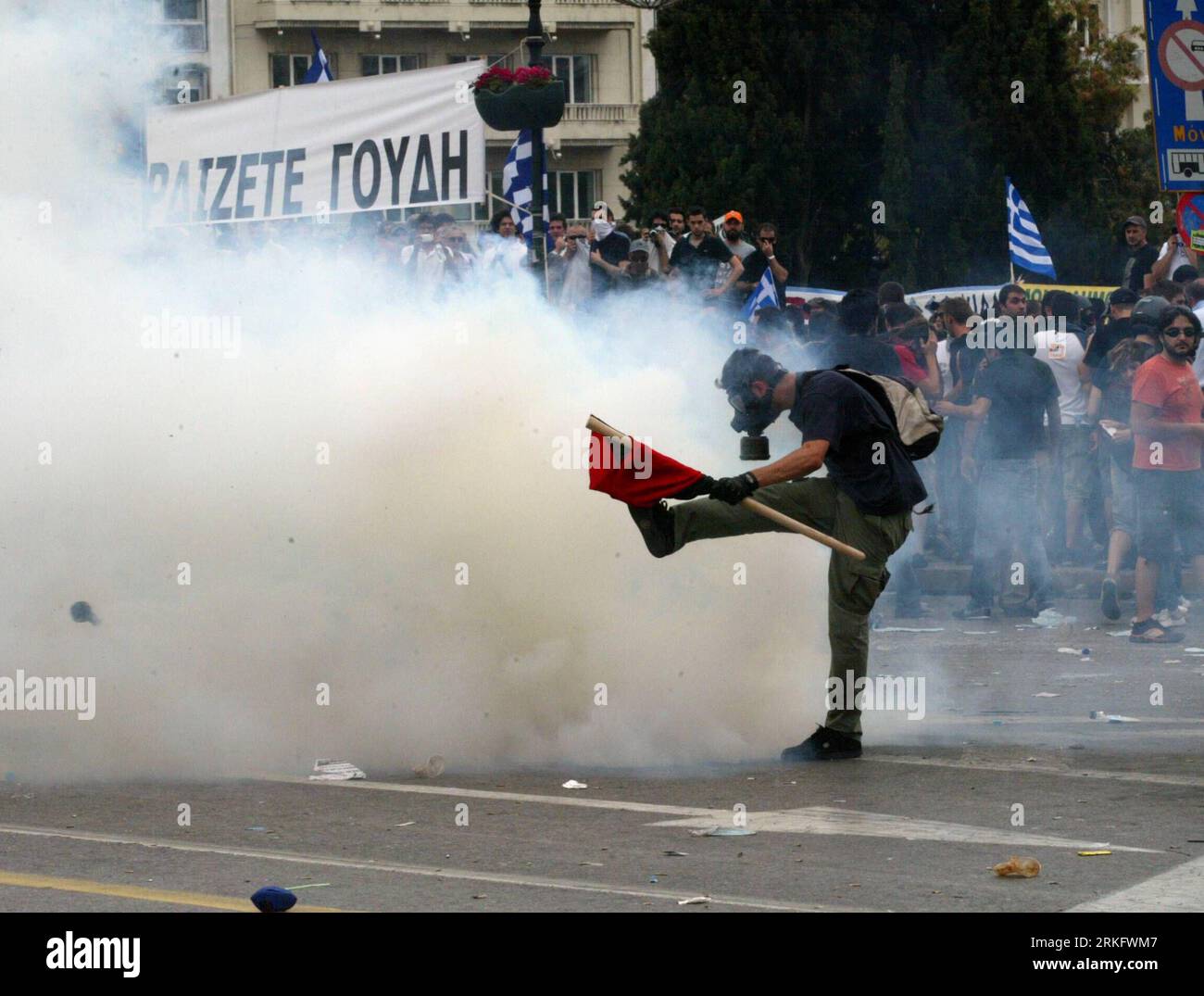 Bildnummer: 55460674  Datum: 15.06.2011  Copyright: imago/Xinhua (110615) -- ATHENS, June 15, 2011 (Xinhua) -- Anti-riot policemen fire tear gas at demonstrators at the Constitution Square in Athens, Greece, June 15, 2011. A new 24-hour nationwide general strike hit Greece Wednesday in protest at further austerity measures planned by the Greek government to counter its acute debt crisis. (Xinhua/Marios Lolos) (wjd) GREECE-AUSTERITY MEASURES-PROTEST PUBLICATIONxNOTxINxCHN Politik Proteste GRE x0x xkg 2011 quer     Bildnummer 55460674 Date 15 06 2011 Copyright Imago XINHUA  Athens June 15 2011 X Stock Photo