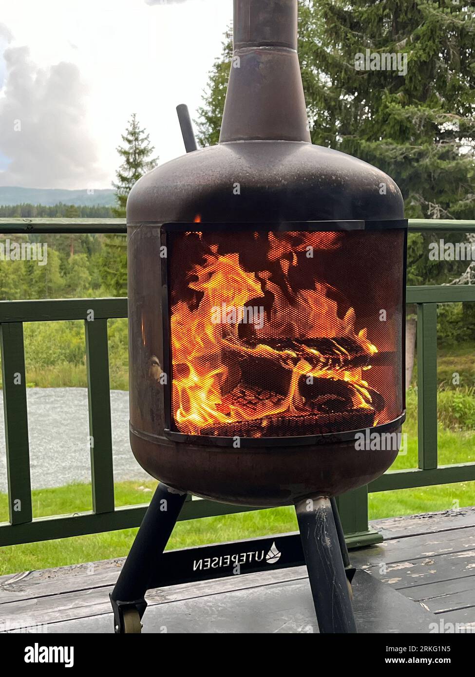 An outdoor firepit with a black steel finish Stock Photo