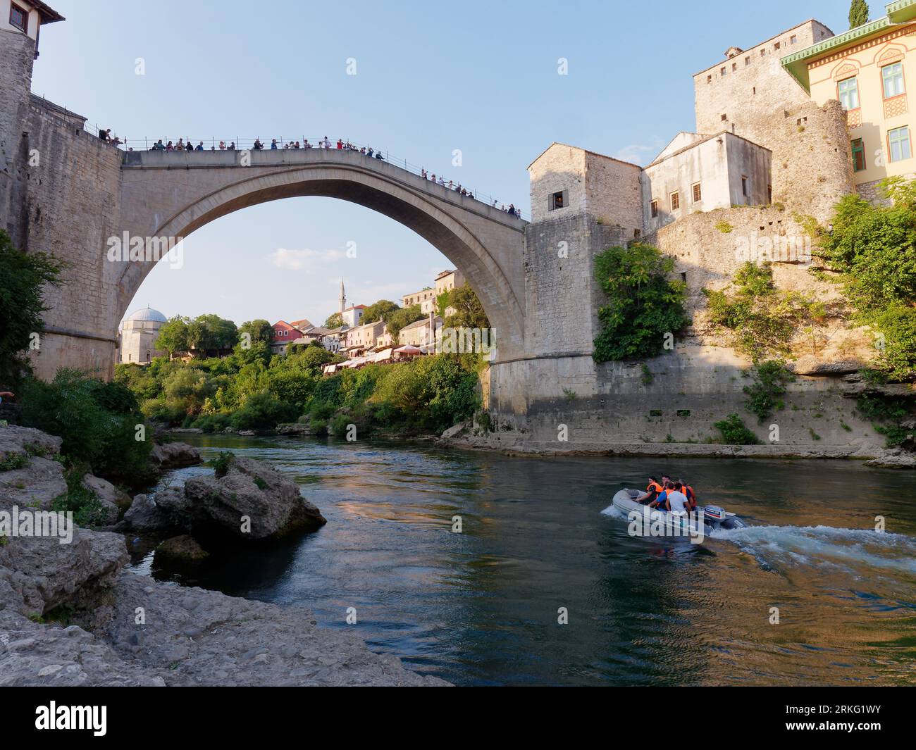 Speed boats on River Neretva with tourists on Stari Most (Old Bridge) in Mostar, Bosnia and Herzegovina, August 20, 2023. Stock Photo