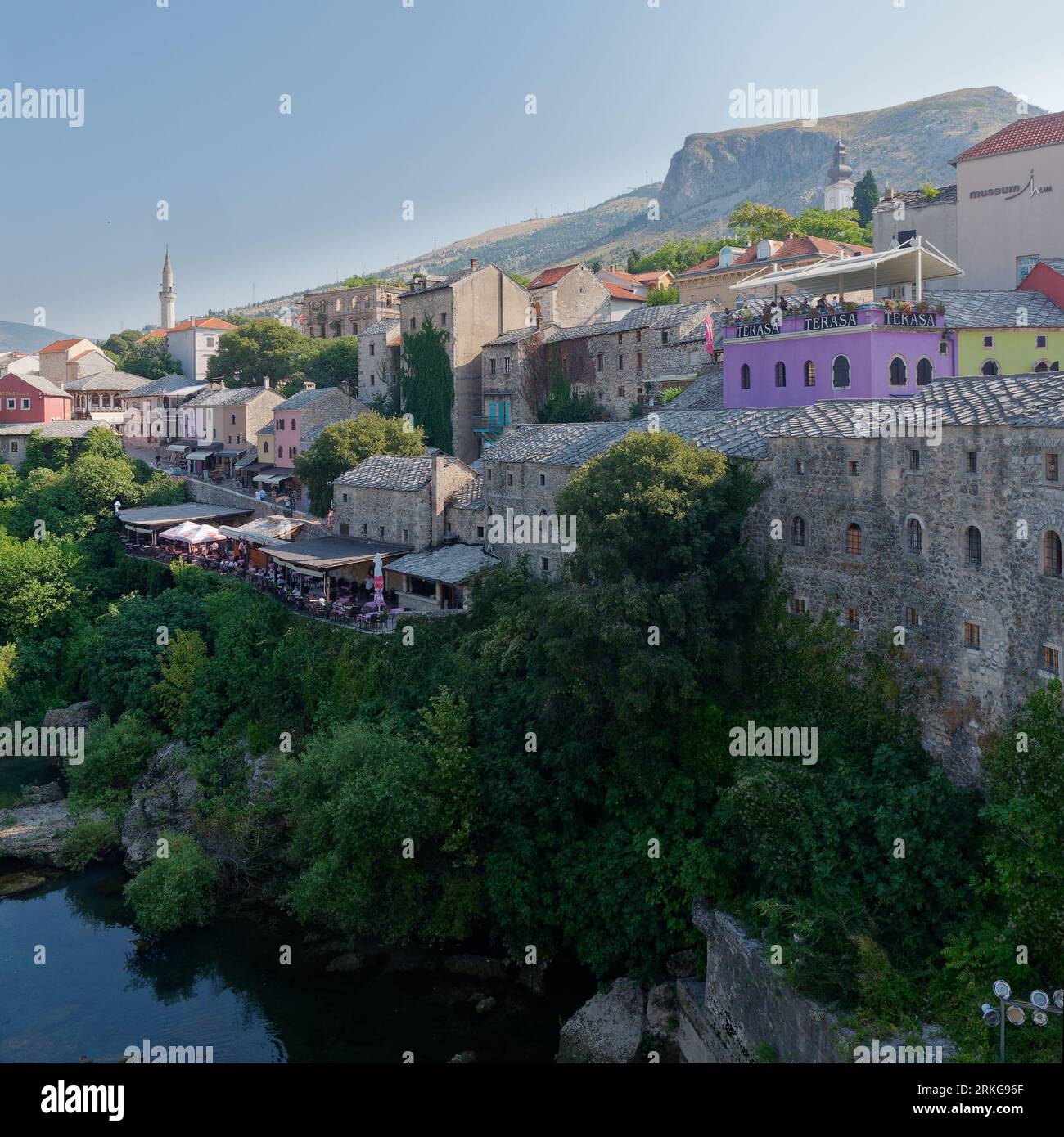 Mostar Old Town Unesco Site with colourful restaurants overlooking the River Neretva on a summers day, Bosnia and Herzegovina, August 23, 2023. Stock Photo