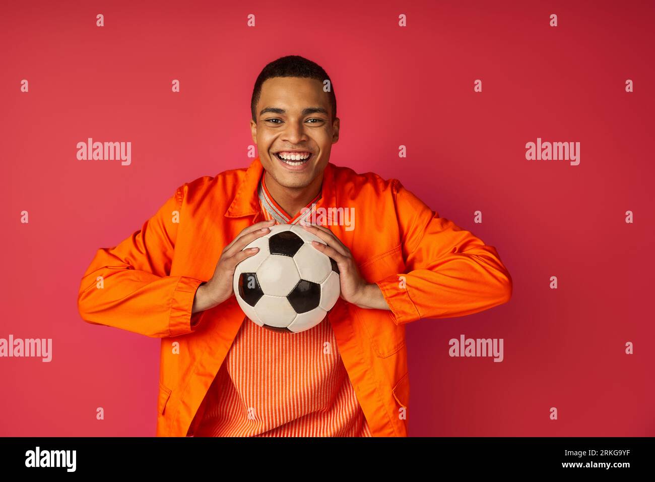 African man holding a soccer ball hi-res stock photography and images ...