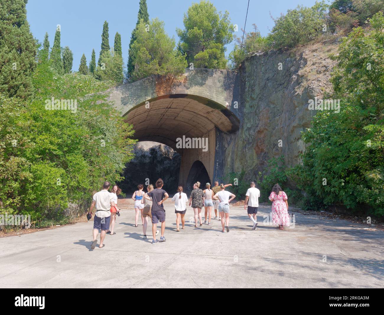 Tour group enter an old secret underground bunker used by Yugoslav Army in Bosnia and Herzegovina, August 24, 2023. Stock Photo