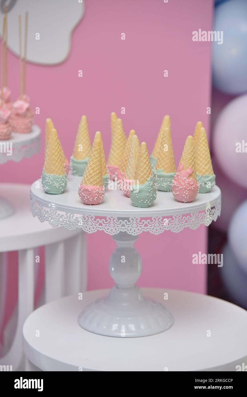 An image of a dessert setup featuring a variety of ice cream cones