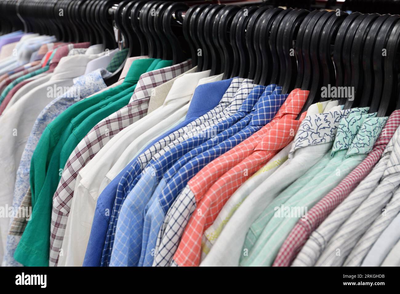 collection of shirts on hangers, men s fashion Stock Photo - Alamy