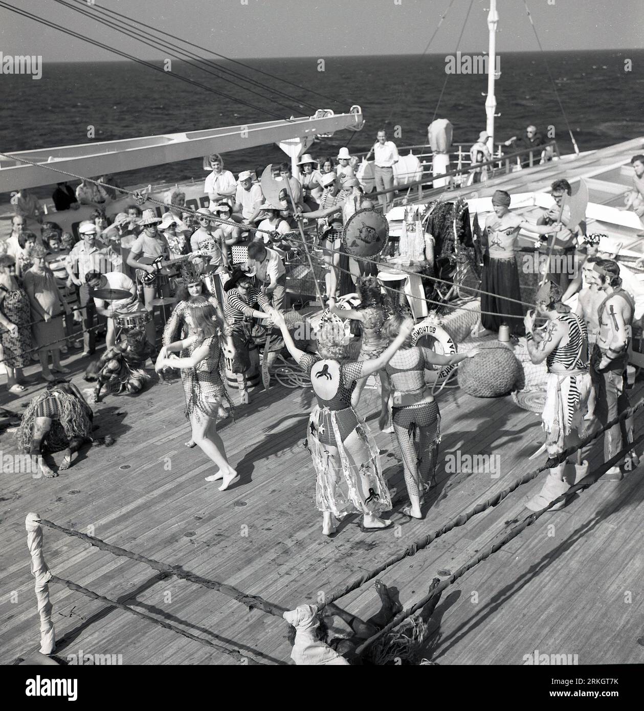 Late 1960s, historical, cruise passengers taking part in the traditional 'crossing the line ceremony', an initiation rite that commemorates a person's first crossing of the equator. Sailors who have crossed the equator are known Shellbacks or Sons of Neptune. Stock Photo