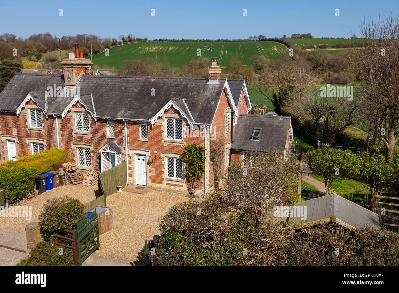 Moulton, Suffolk, England - April 1 2019: Traditional brick built homes in suffolk village taken from an elevated position along public highway with c Stock Photo