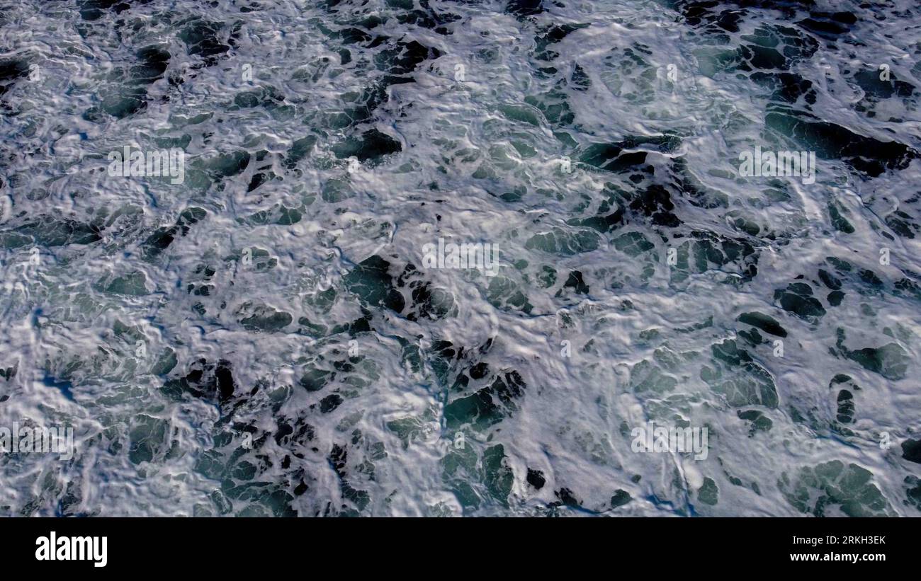 An aerial view of foam waves of the ocean Stock Photo - Alamy
