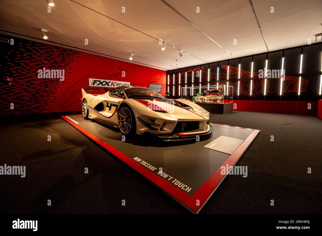 A Ferrari sportscar displayed in a museum showroom in Italy. Stock Photo