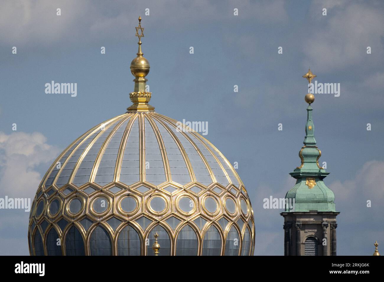23 August 2023, Berlin: The dome of the New Synagogue Berlin and the tower of the Sophienkirche. Photo: Sebastian Gollnow/dpa Stock Photo