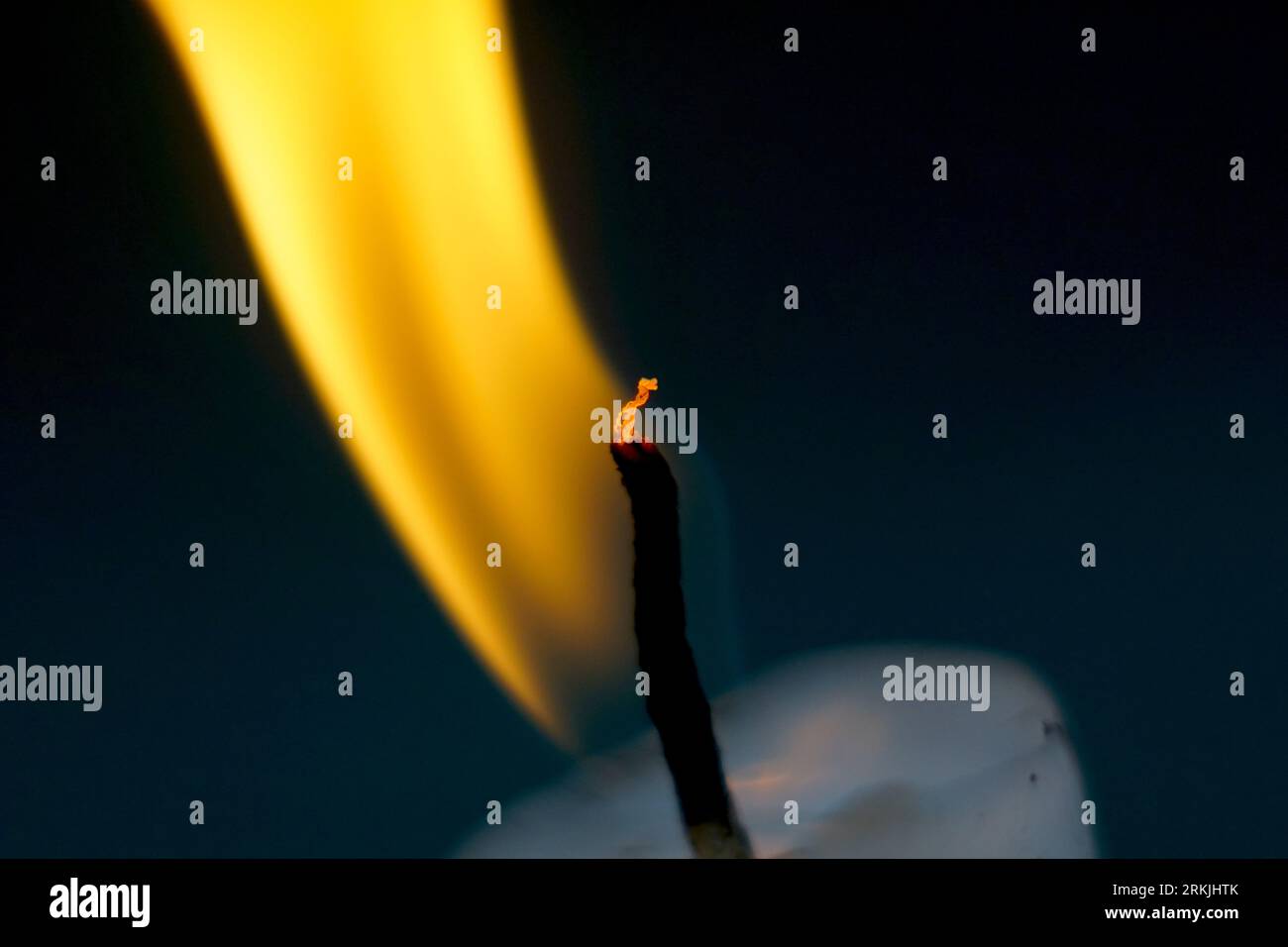 Burning candles on dark background Stock Photo - Alamy