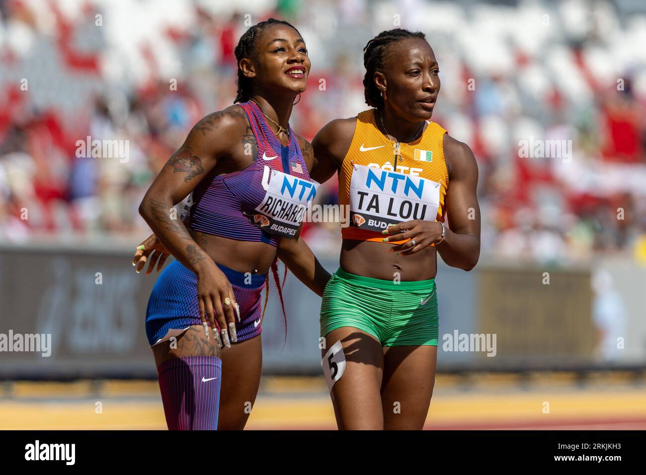 ShaCarri Richarson (USA) and Marie-Josee Ta Lou (CIV) watch for times of the 200 during the World Athletics Championships Budapest23 at The National Stock Photo