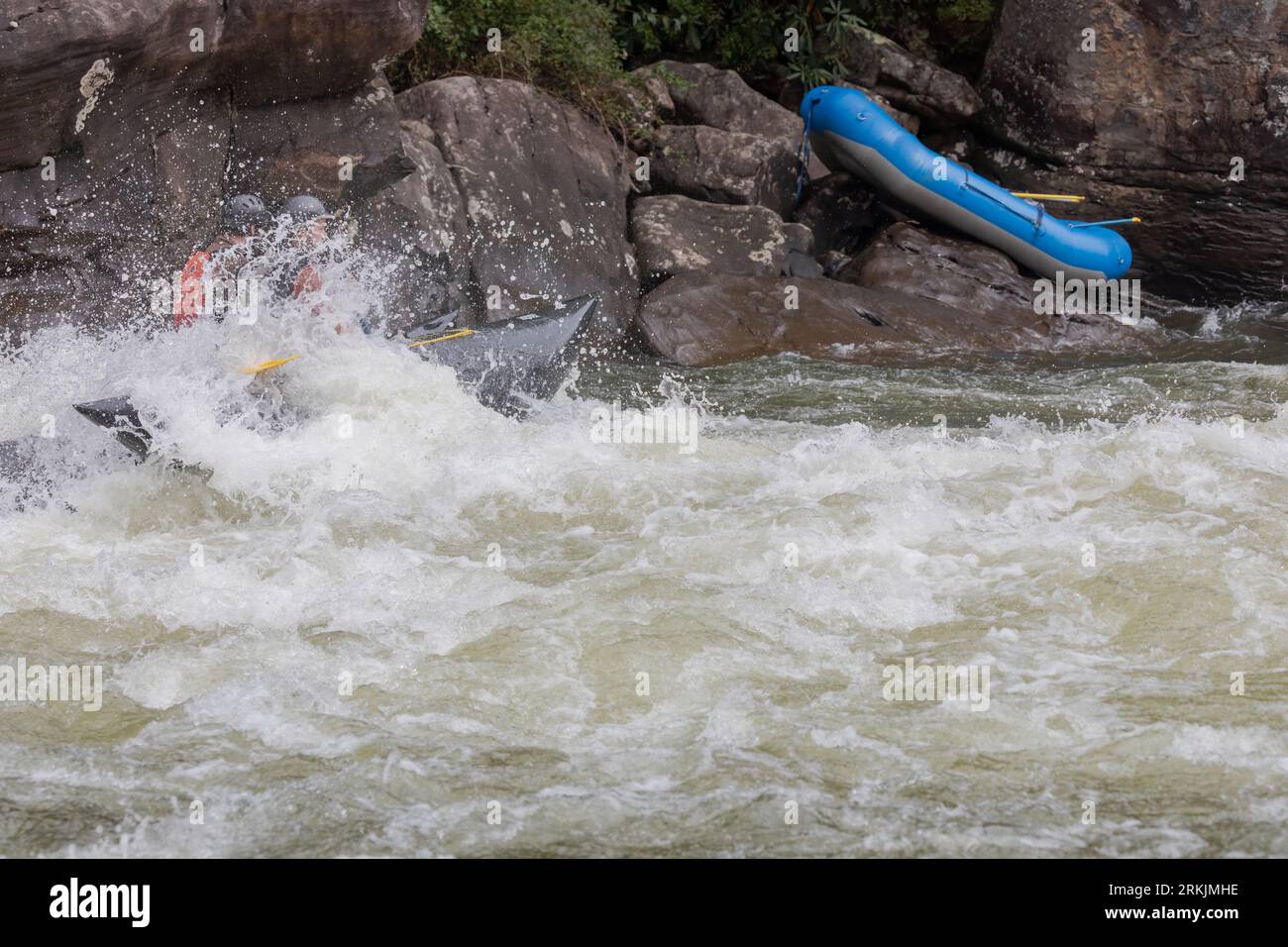 An adventurous kayaker navigating the challenging rapids of the Gauley River in West Virginia Stock Photo