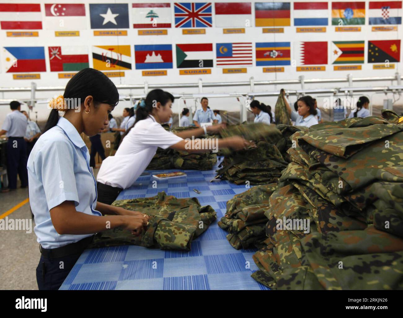 Bildnummer: 56146654  Datum: 20.09.2011  Copyright: imago/Xinhua (111005) -- JAKARTA, Oct. 5, 2011 (Xinhua) -- Workers check army uniforms at Sritex textile factory in this file photo taken in Solo, central Java province, on Sept. 20, 2011. Exports of textiles and textile products (TPT) of Indonesia increased 20 percent, or 1.8 billion US dollars, in the first half of 2011, according to the Indonesian Textile Association (API). (Xinhua/Dadang Tri) (zf) INDONESIA-ECONOMY-TEXTILES PUBLICATIONxNOTxINxCHN Wirtschaft Textilindustrie Produktion Uniform Militär Gesellschaft Arbeitswelten xjh x0x 2011 Stock Photo